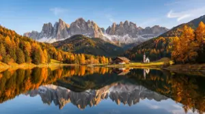 Paesaggio autunnale in Trentino con lago, foresta colorata e montagne sullo sfondo